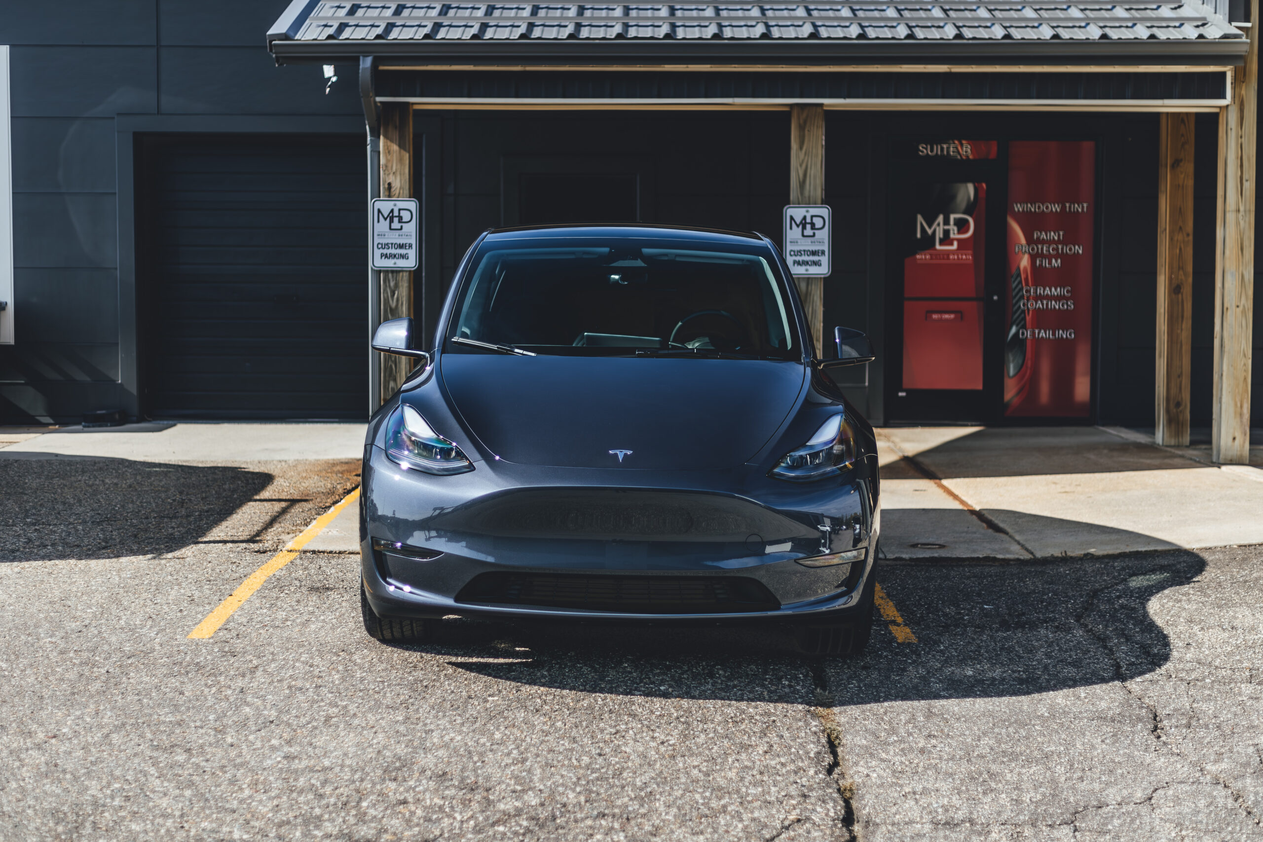 Tesla Model Y with Full Front Paint Protection Film by Med City Detail.